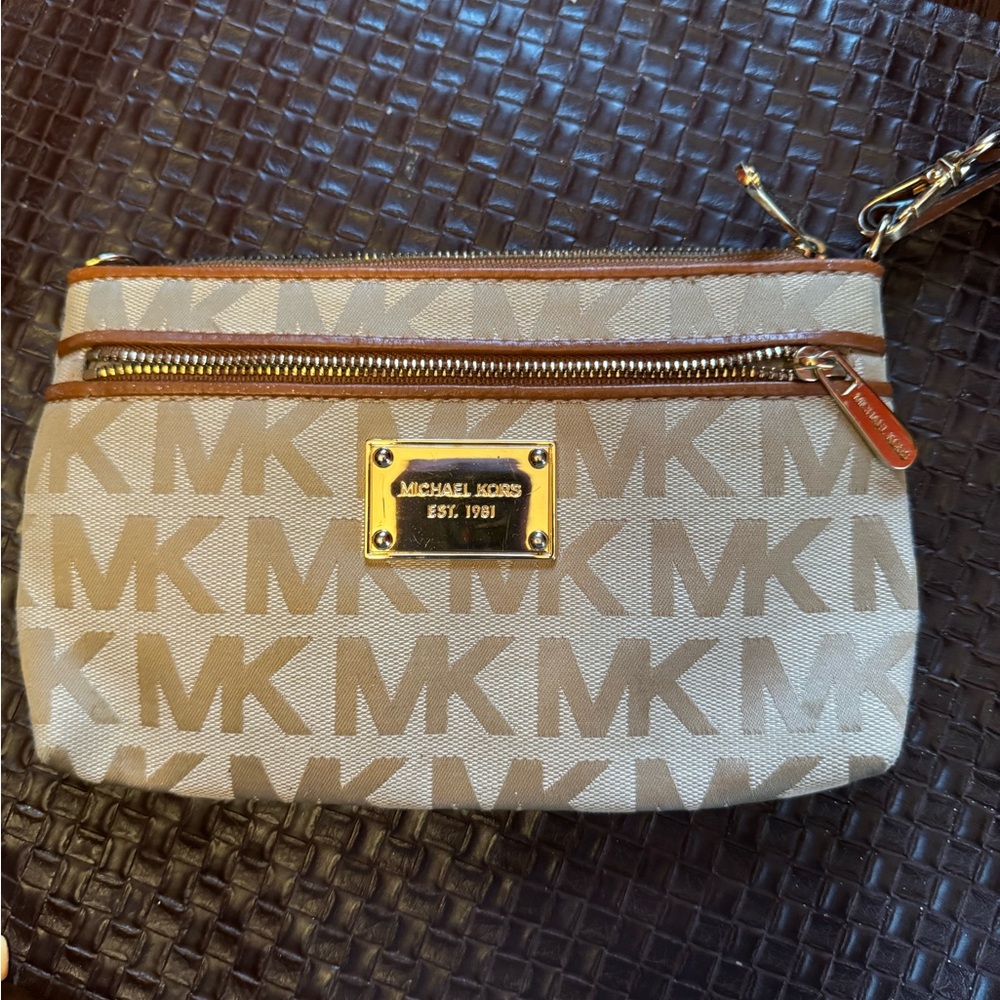 Michael Kors cream and brown wristlet with gold accent